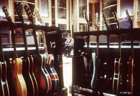Noel Gallagher and some of his many guitars